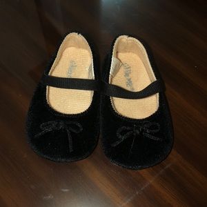 Black baby shoes.